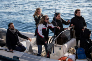 Italian Members of Parliament Stefania Prestigiacomo (C), Nicola Fratoianni (C-R), Riccardo Magi (Rear R) and the major of Syracuse, Francesco Italia (L) arrive aboard a dinghy to board the Dutch-flagged rescue vessel Sea Watch 3, to meet with 47 migrants and verify the situation onboard, on January 27, 2019 off Syracuse, Sicily. - Members of parliament who had been refused permission by the ministry to board the Sea Watch 3 made their own way onto the vessel which has taken shelter from bad weather off the coast of Sicily. Italy's interior minister Matteo Salvini said on January 27 he was gathering legal evidence against the crew of the Dutch-flagged rescue ship as calls grew for 47 migrants to be allowed to land. (Photo by FEDERICO SCOPPA / AFP)