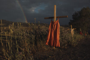 A red dress along the highway signifies the children who died at the Kamloops Indian Residential School in Kamloops, British Columbia on Saturday, June 19, 2021. Red dresses are also used to signify the disproportionate number of missing and murdered Indigenous women and girls. Amber Bracken for The New York Times